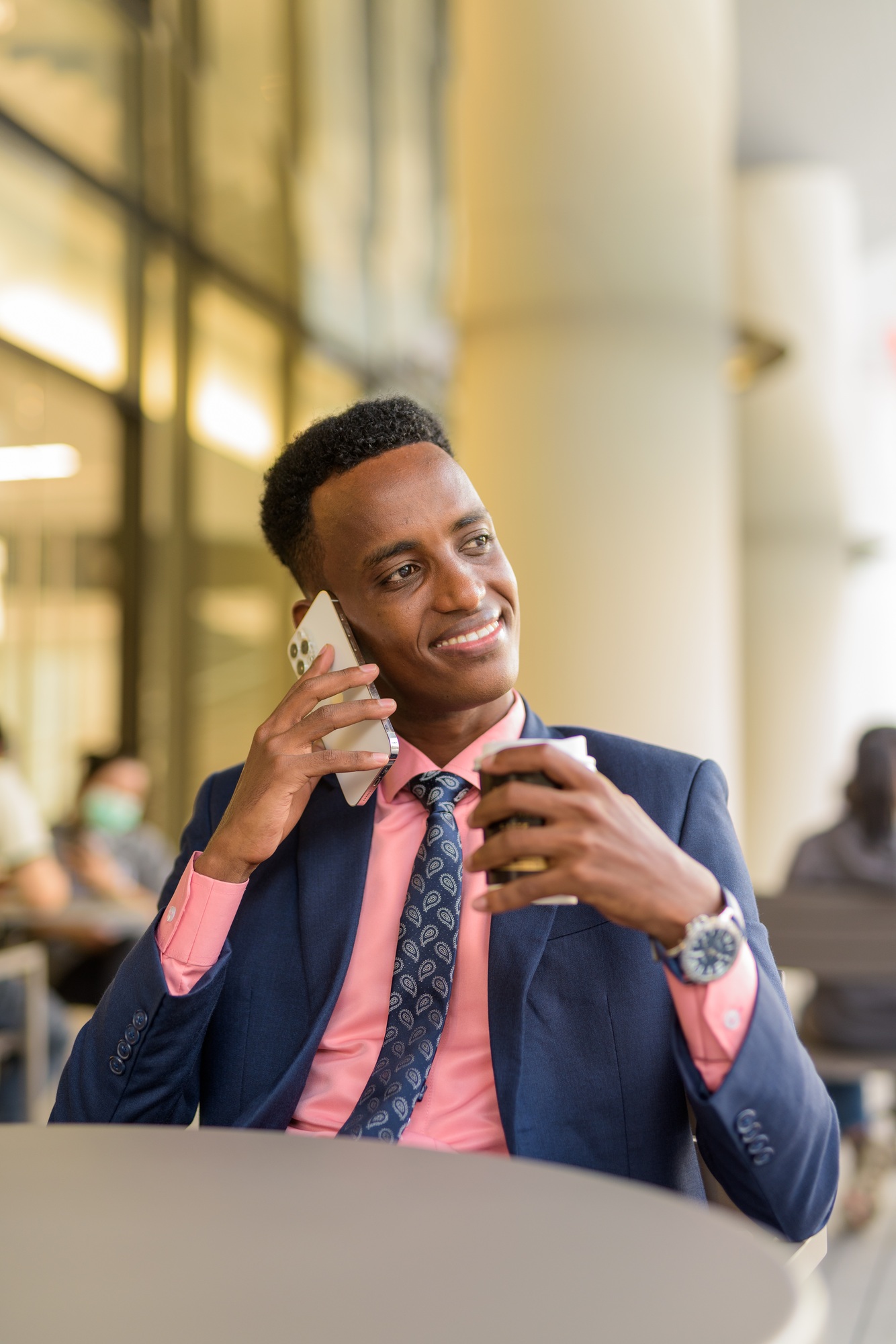 Portrait of successful young African businessman wearing suit and tie